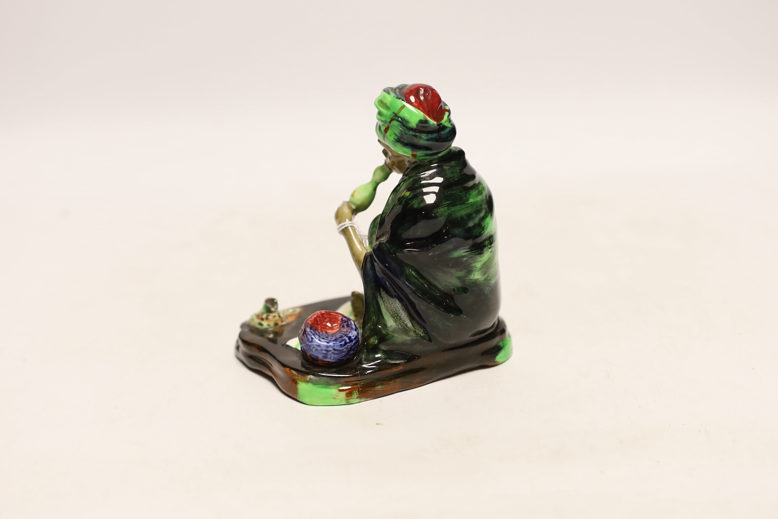 A Royal Doulton figure of The Snake Charmer HN1317, signed EL, 11.5cm